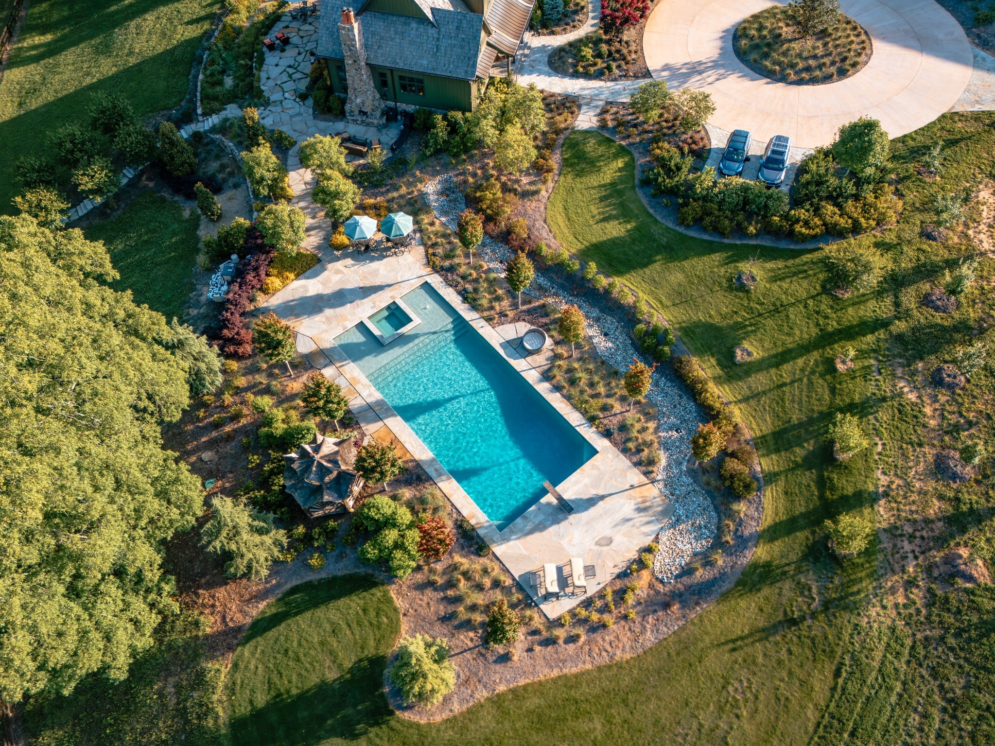 Aerial view of pool and landscaped property